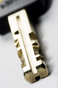 key with shallow depth of field on grey background